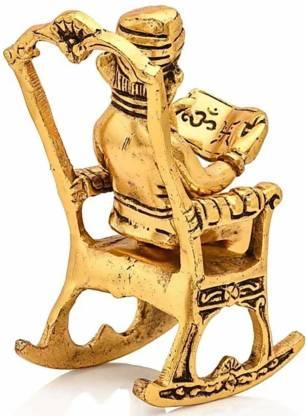 Golden Lord Ganesha Statue Sitting On A Rocking Chair And Reading Ramayan Showpiece